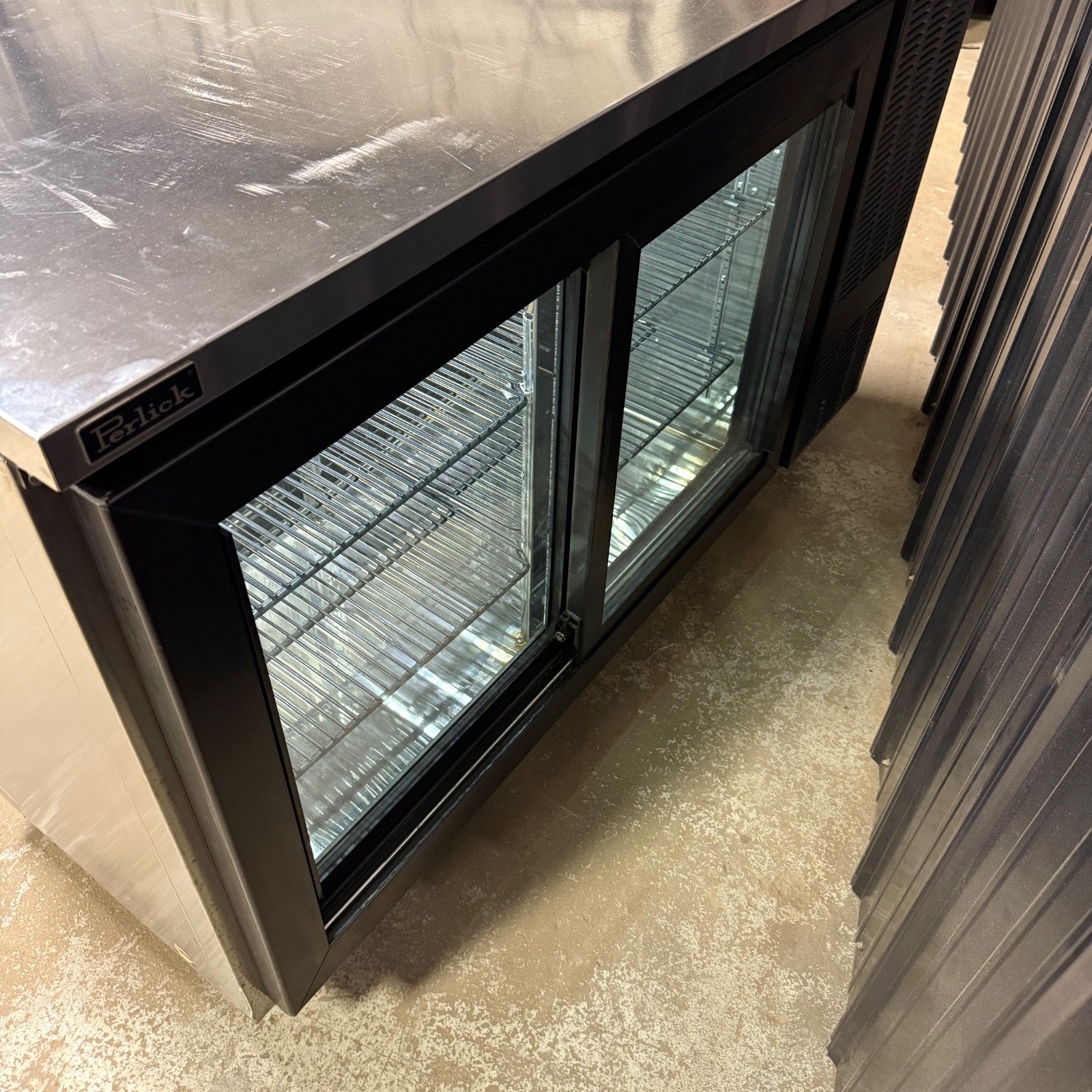Perlick SDPS60 60" Black Pass-Thru Sliding Door Back Bar Refrigerator